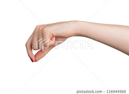A hand with fingers pinching a small, invisible object. The gesture, made by a woman with elegant 116944988