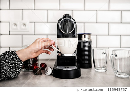 Capsule coffee machine at domestic kitchen Capsule coffee machine at domestic kitchen 116945767