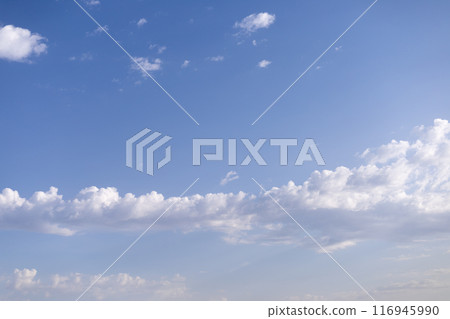 white clouds on the background of the blue sky, sunset 116945990