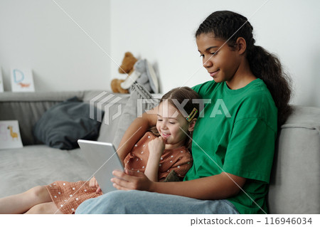 Girls watching online movie or video Girls watching online movie or video 116946034