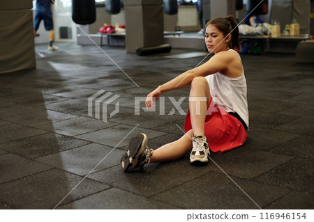Girl doing stretching exercise for legs 116946154