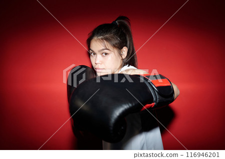 Practicing kick during boxing training 116946201