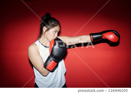 Girl practicing kicks during training 116946205