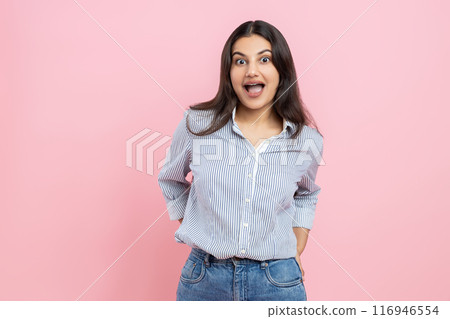 Excited emotional Indian woman wearing casual shirt 116946554