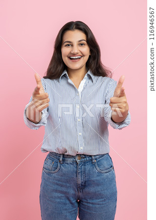 Excited positive Indian woman gesturing thumbs up Excited positive Indian woman gesturing thumbs up 116946567