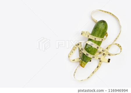 Zucchini with measuring tape on white background 116946994