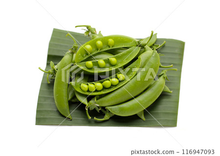 Fresh young green peas on white background. Fresh young green peas on white background. 116947093