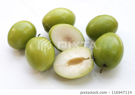 Green jujube fruits on white background. Green jujube fruits on white background. 116947114