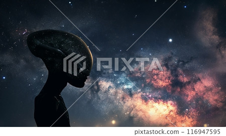 An enigmatic alien silhouetted against the starry backdrop of space 116947595