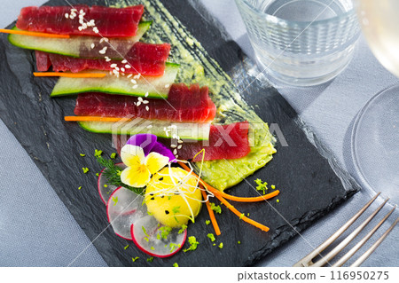 Tuna carpaccio with avocado sauce 116950275