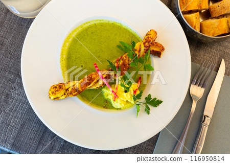Cream soup of courgette with grissini Cream soup of courgette with grissini 116950814