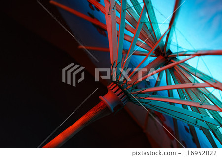 A beautiful Japanese umbrella with blue illumination 116952022