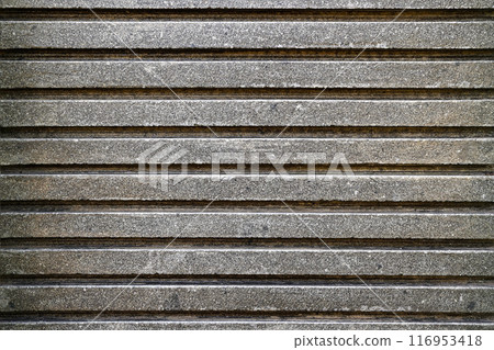 The image is a close up of a gray and black striped surface 116953418