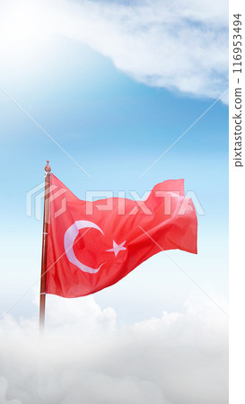 A Turkey flag with a white star and crescent moon flying in the sky A Turkey flag with a white star and crescent moon flying in the sky 116953494