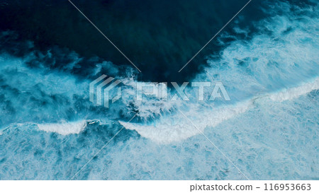 Turquoise ocean sea water white wave pattern splashing deep blue sea. Seascape dark ocean background wave splash on rock. Tropical sea beach in summer seaside outdoor. Water Surface blue wave pattern Turquoise ocean sea water white wave pattern splashing deep blue sea. Seascape dark ocean background wave splash on rock. Tropical sea beach in summer seaside outdoor. Water Surface blue wave pattern 116953663