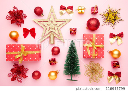 Christmas composition made of christmas decoration on pink background. Flat lay 116955799