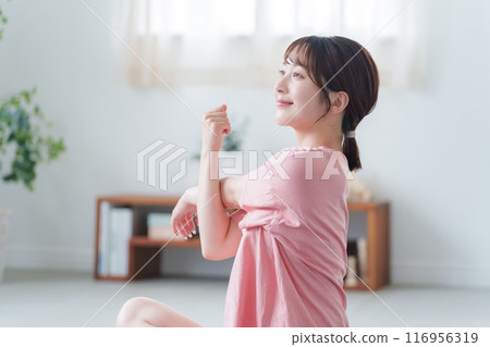 A young woman stretching A young woman stretching 116956319