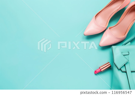 Pink shoes, lipstick and handbag on a blue background. Stylish fashion background 116956547