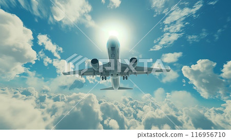 Airplane in the blue sky with white clouds and sun rays 116956710