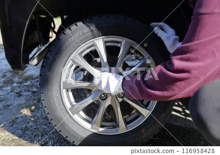 Replacing winter tires of a private car (studless tires) Replacing winter tires of a private car (studless tires) 116958428