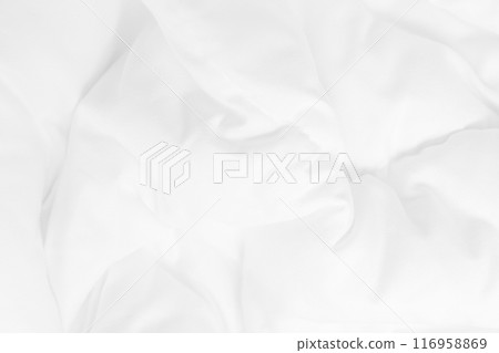 Close up top view of white bedding sheet and wrinkle messy blanket in bedroom after wake up in the morning. 116958869