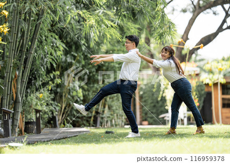 Asian Woman Grabbing and Catching Man shoulder and bracing the man to live with her. Asian Woman Grabbing and Catching Man shoulder and bracing the man to live with her. 116959378