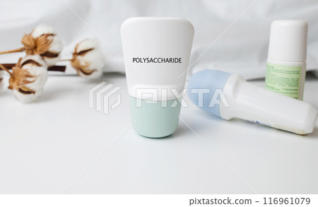 Polysaccharide in deodorant. Safe components and ingredients of cosmetics for care. Protection of armpits from sweating. Antiperspirants on the table, viewed under a magnifying glass 116961079