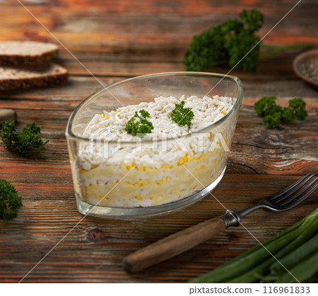 Layered grated cheese with polenta 116961833
