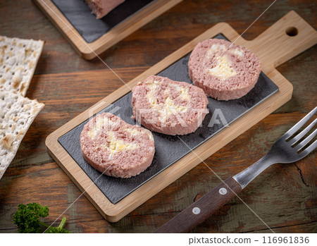 Slices of savory meatloaf with egg filling 116961836
