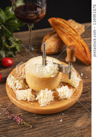 Traditional girolle on a rustic wooden table 116961878