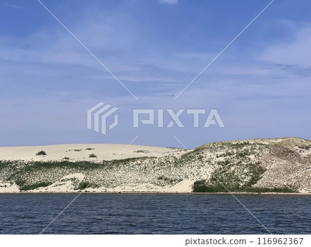 Nida - Curonian Spit and Curonian Lagoon, Nida, Klaipeda, Lithuania. Nida harbour. Baltic Dunes. Unesco heritage. Nida is located on the Curonian Spit Nida - Curonian Spit and Curonian Lagoon, Nida, Klaipeda, Lithuania. Nida harbour. Baltic Dunes. Unesco heritage. Nida is located on the Curonian Spit 116962367