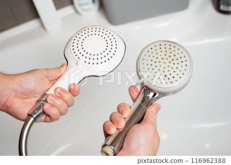 Replacing an old shower head with a new one. Poor water quality and limescale buildup on plumbing fixtures. Periodic replacement and maintenance of cleanliness. Mold and bad smell of water. 116962388