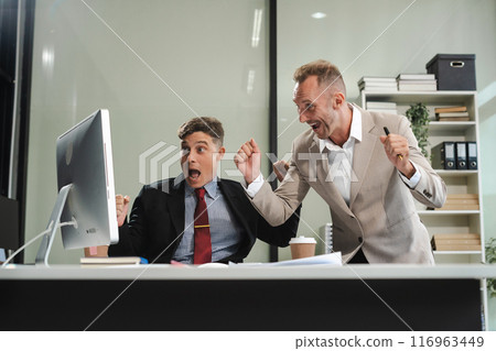 Group of International team of businessmen creative businesspeople coworker in office Happy to be successful partnership teamwork success concept. Group of International team of businessmen creative businesspeople coworker in office Happy to be successful partnership teamwork success concept. 116963449