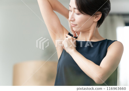 Woman looking at armpits Hair removal Woman looking at armpits Hair removal 116963660