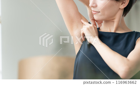 Woman looking at armpits Hair removal Woman looking at armpits Hair removal 116963662