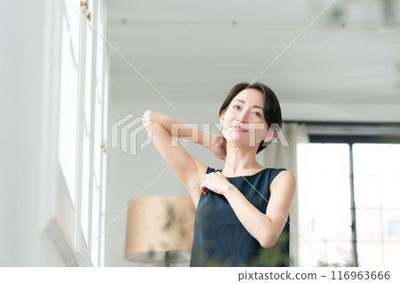 Woman looking at armpits Hair removal 116963666