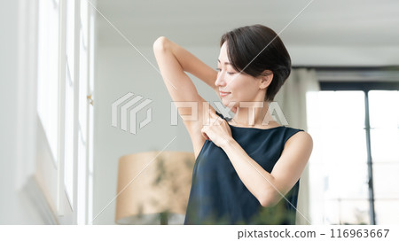 Woman looking at armpits Hair removal Woman looking at armpits Hair removal 116963667