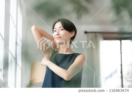 Woman looking at armpits Hair removal 116963674