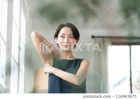 Woman looking at armpits Hair removal 116963675