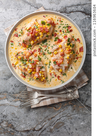 Creamy Chicken Corn and bacon closeup on the plate. Vertical top view Creamy Chicken Corn and bacon closeup on the plate. Vertical top view 116963684