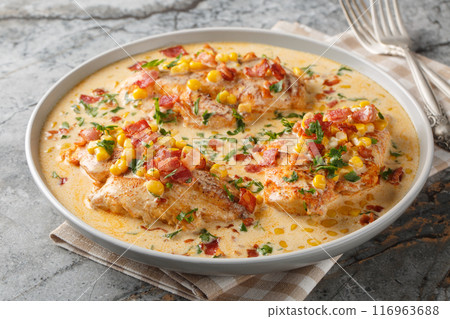 Garlic butter, bacon and creamy corn chicken closeup on the plate. Horizontal 116963688