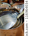 Big group of stacked classic copper saucepans 116964034