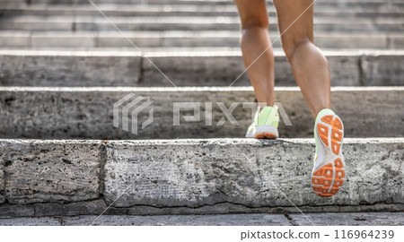 Runner athlete legs running on city stairs. woman fitness jogging workout wellness concept Runner athlete legs running on city stairs. woman fitness jogging workout wellness concept 116964239