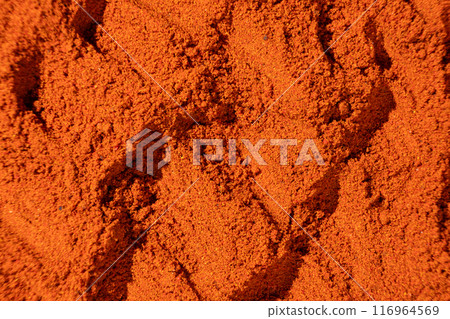 Ground paprika, red terracotta spice background, art in cooking. 116964569