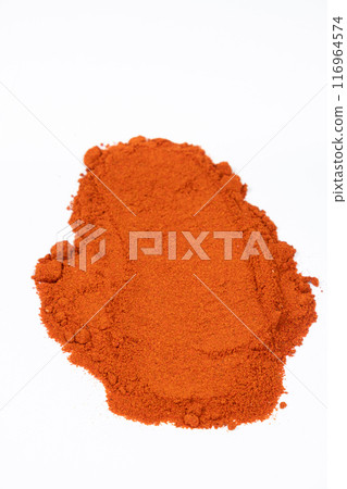 A smear of ground spice paprika on a white background. A smear of ground spice paprika on a white background. 116964574