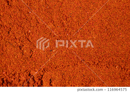 Abstract red background made of smoked paprika. Spice texture, art in food. Abstract red background made of smoked paprika. Spice texture, art in food. 116964575