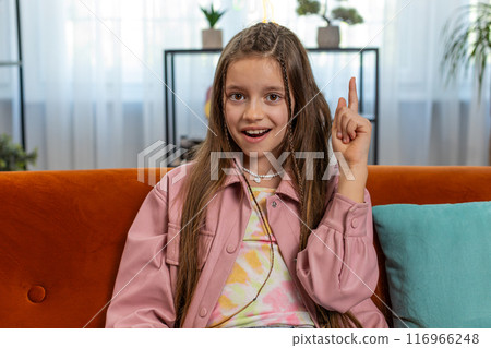 Inspired child girl pointing finger up having good idea plan showing inspiration motivation gesture Inspired child girl pointing finger up having good idea plan showing inspiration motivation gesture 116966248