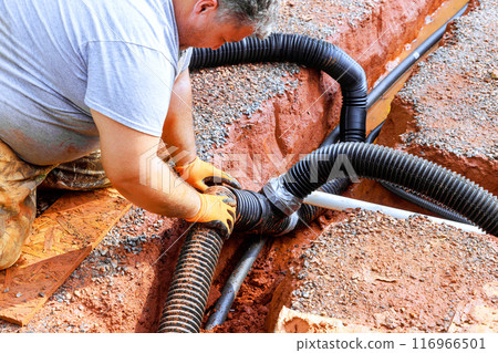 Putting in place drainage pipes for outflow of rainwater stormwater underground 116966501