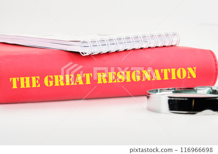 Text THE GREAT RESIGNATION, mass voluntary exodus from the workforce. THE GREAT RESIGNATION on the cover of the book on a white background Text THE GREAT RESIGNATION, mass voluntary exodus from the workforce. THE GREAT RESIGNATION on the cover of the book on a white background 116966698