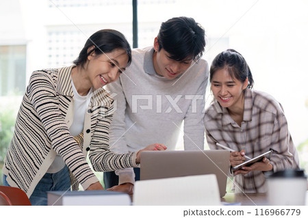 Group of Student Collaboration on a Project with a Laptop in a Modern Classroom Setting Group of Student Collaboration on a Project with a Laptop in a Modern Classroom Setting 116966779